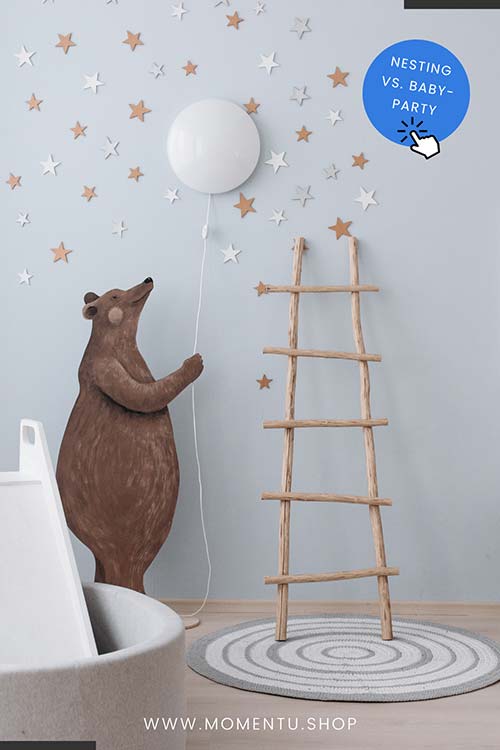 Bei einer Nesting Party das Kinderzimmer dekorieren und die Wand mit einem Bären bemalen